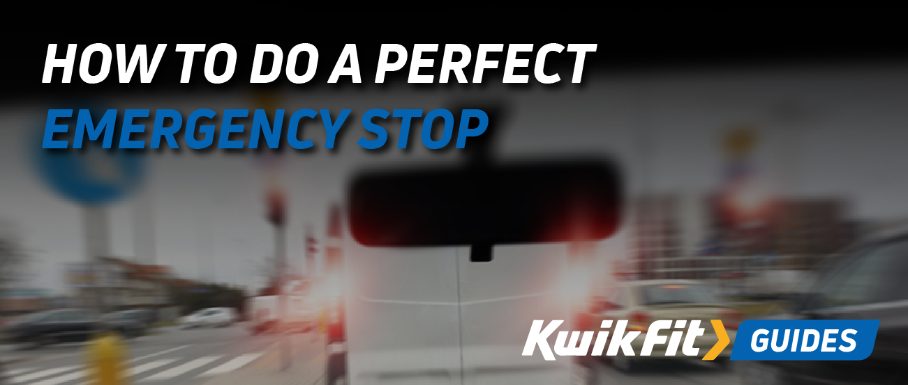 A blurry image out the front window of a car.