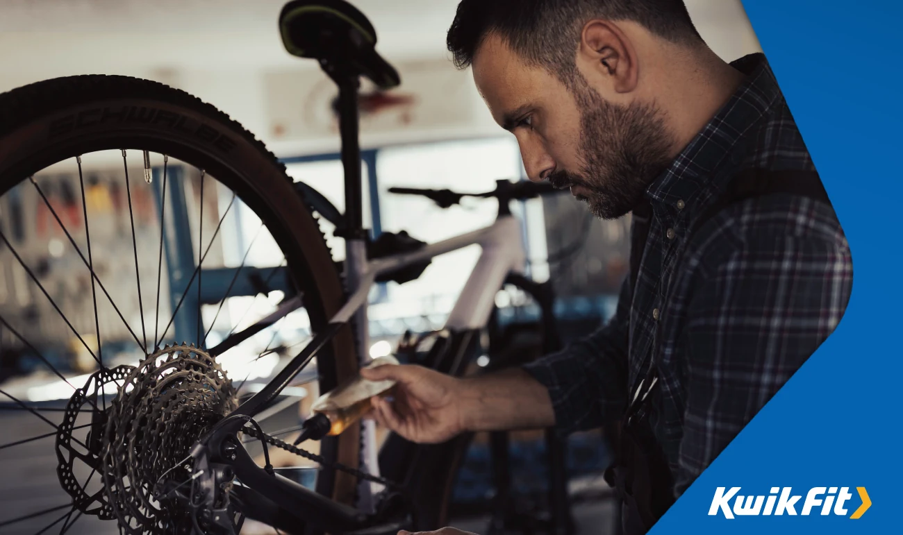 lubricating a bike chain in a bike shop