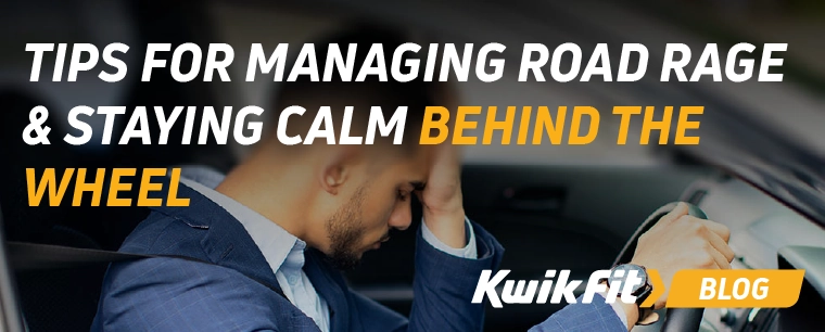 A driver with their heads in their hand