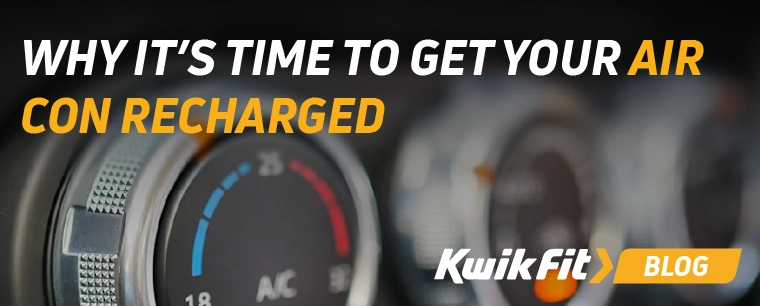 A dial in the car which says AC